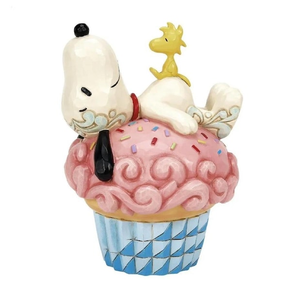 Peanuts by Jim Shore - Snoopy Laying on Cupcake